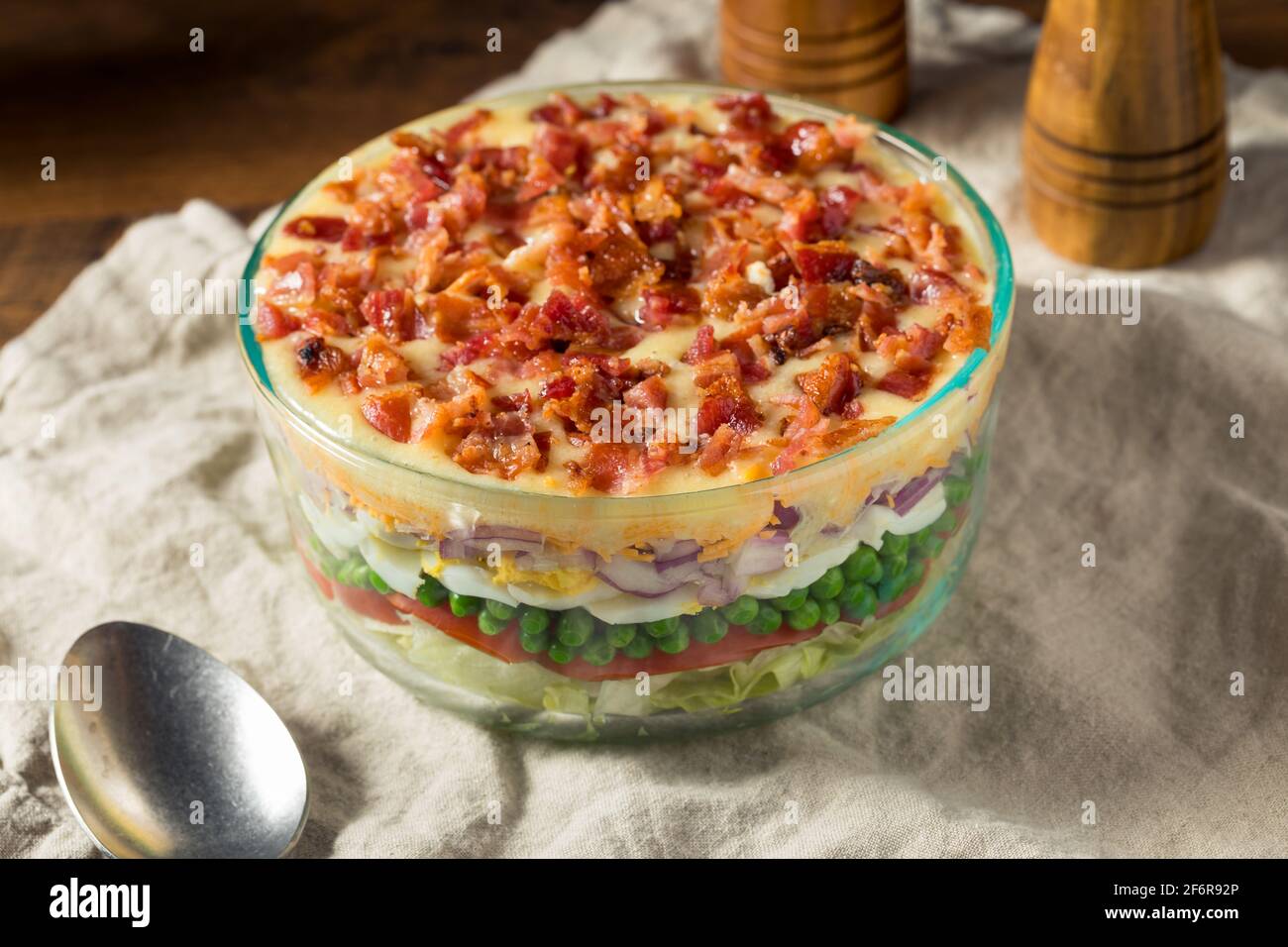 Homemade Seven Layer Salad with Eggs Bacon Peas and Lettuce Stock Photo