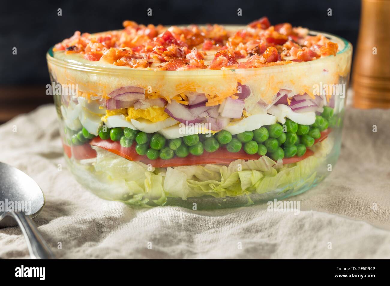 Homemade Seven Layer Salad with Eggs Bacon Peas and Lettuce Stock Photo