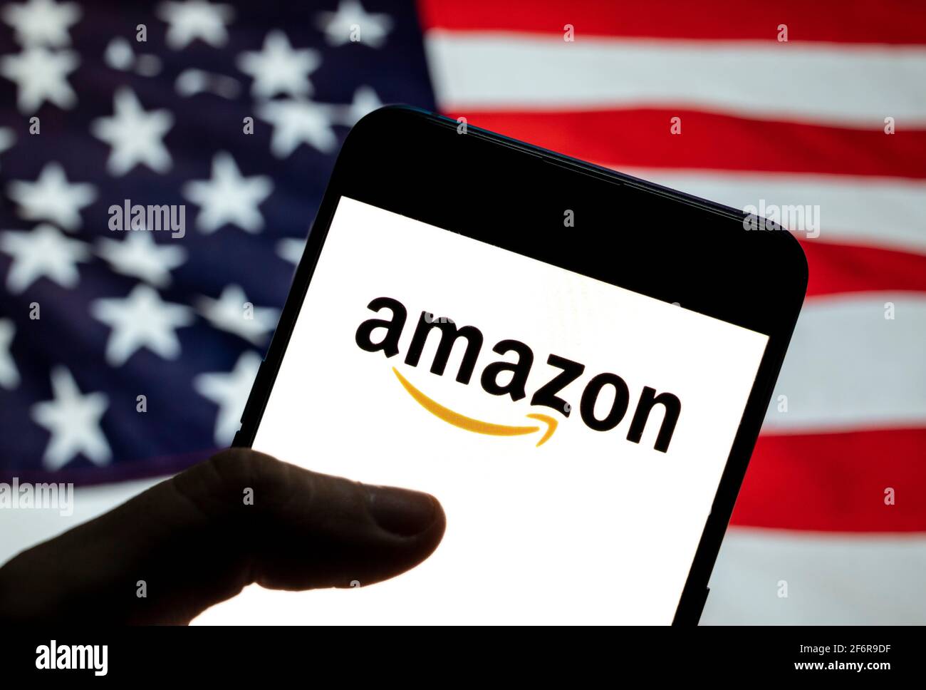 In this photo illustration the American electronic commerce and cloud  computing company Amazon logo is seen on an Android mobile device with  United States of America (USA), commonly known as the United