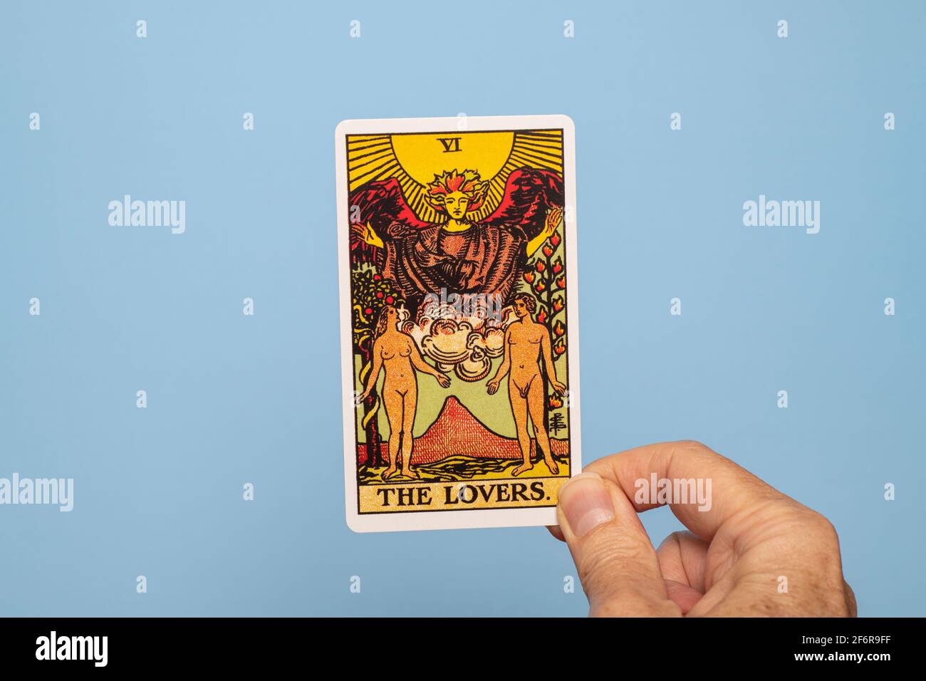 Hand holding The Lovers Tarot card Stock Photo Alamy