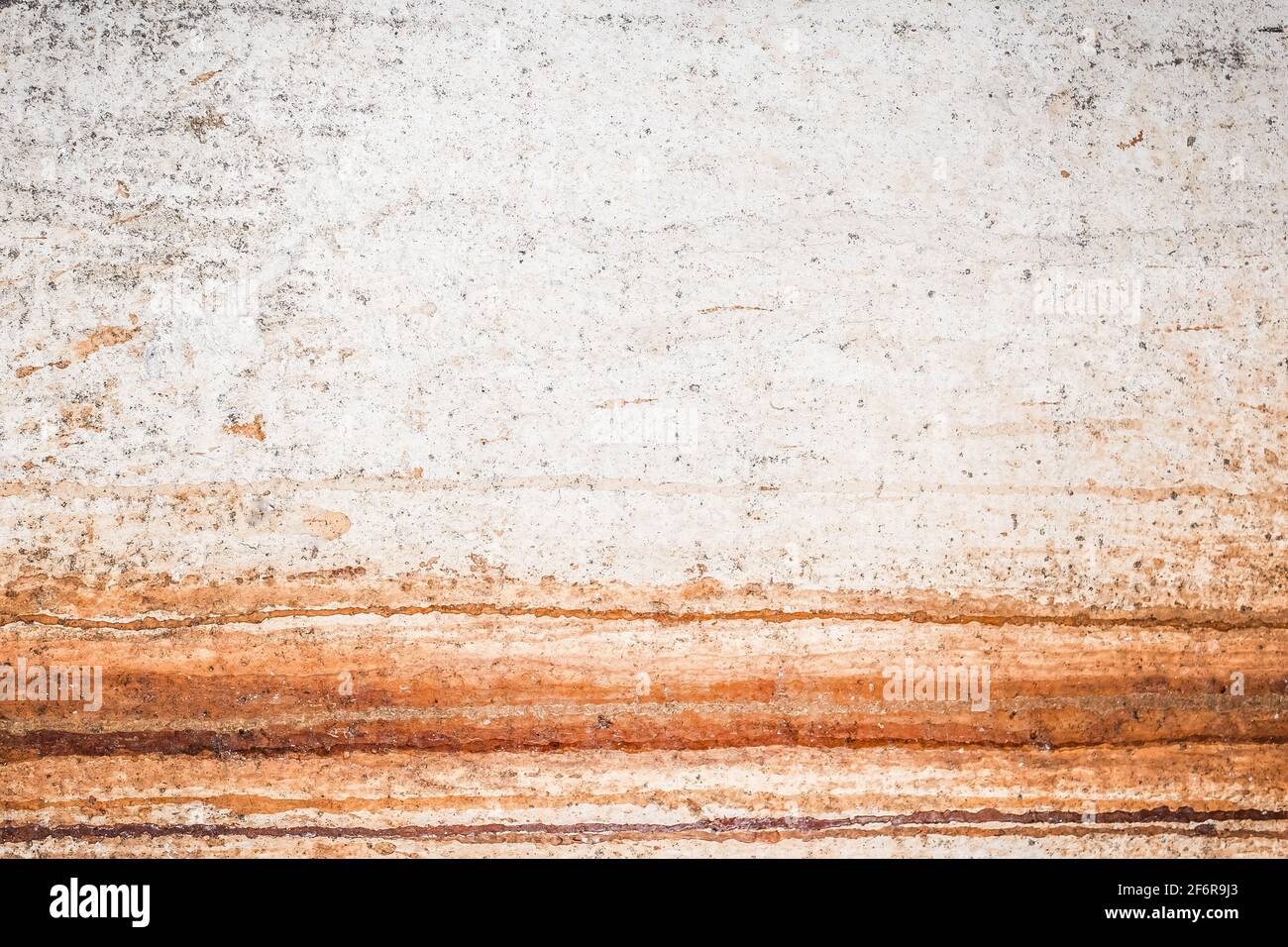 Old white dirty concrete wall texture with abstract rusty pattern background. Stock Photo