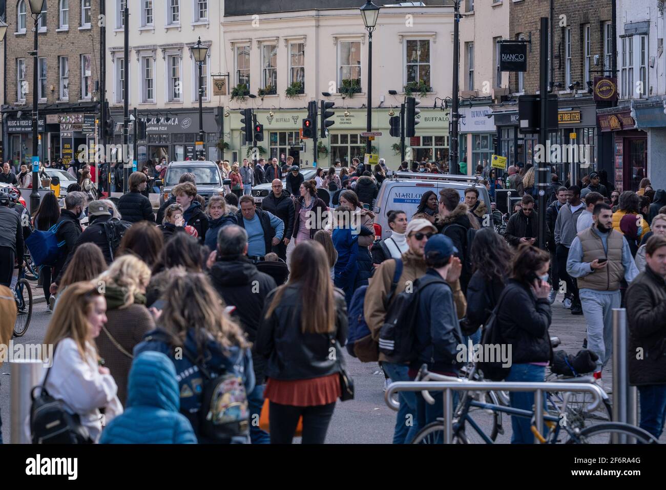 London, UK. 2nd April, 2021. Lockdown Easing: Greenwich sees sizable crowds return to the high street as lockdown rules continue to be eased. Current rules state that outdoor gatherings are allowed of up to six people, or two households if larger, not just in parks but also gardens. Credit: Guy Corbishley/Alamy Live News Stock Photo