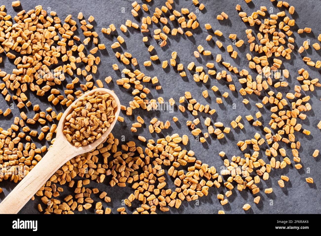 Organic fenugreek seeds - Trigonella foenum - graecum Stock Photo