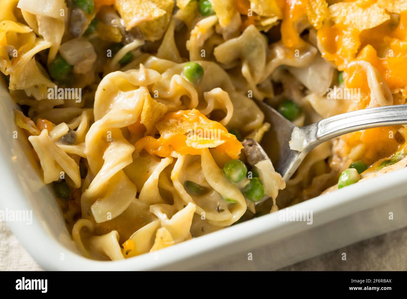 Homemade Cheesy Tuna Casserole with Peas and Egg Noodles Stock Photo