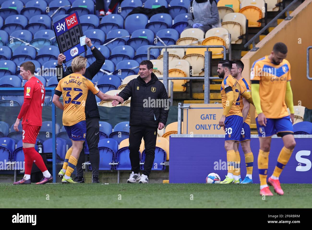 MANSFIELD, UK. APRIL 2ND: Mansfield Town manager, Nigel Clough interacts with George Lapslie of Mansfield Town during the Sky Bet League 2 match between Mansfield Town and Leyton Orient at the One Call Stadium, Mansfield on Friday 2nd April 2021. (Credit: James Holyoak | MI News) Credit: MI News & Sport /Alamy Live News Stock Photo
