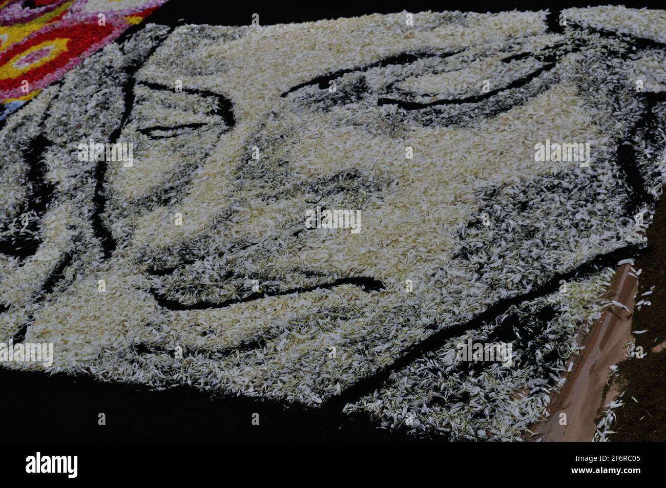 the ephemeral art of flowers turns the face of Jesus Christ into a