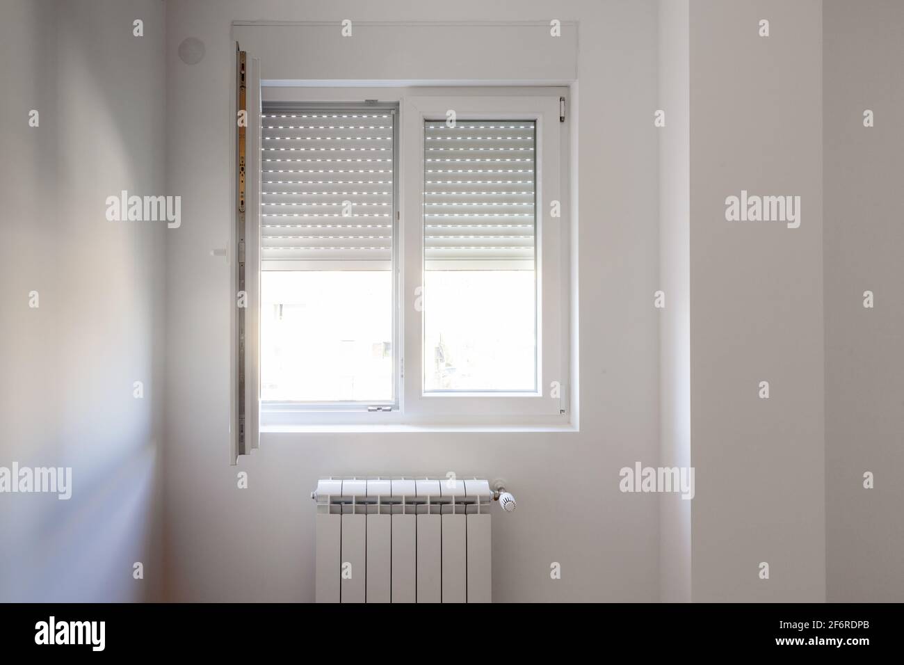 empty room with two windows and parquet Stock Photo