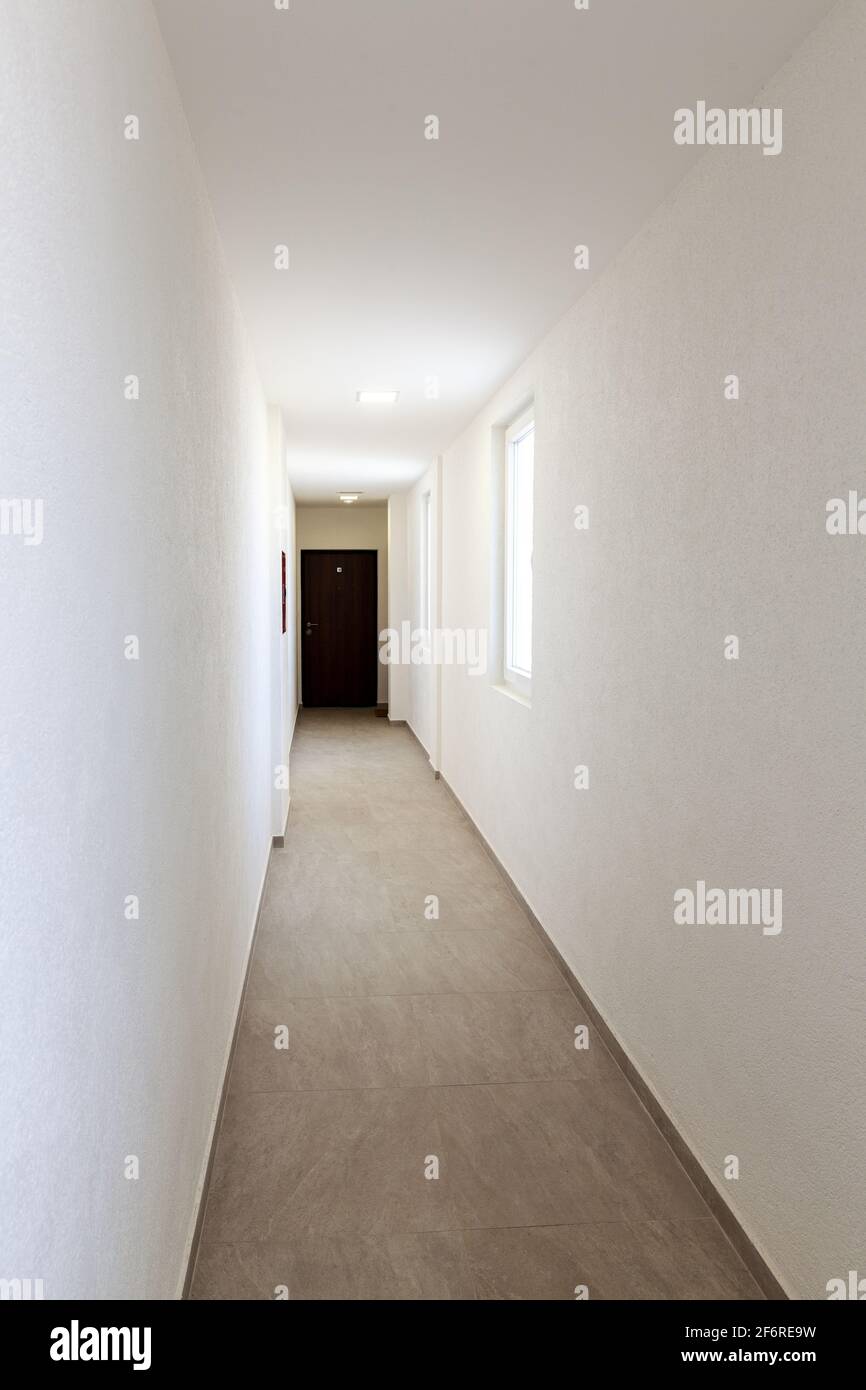 hallway in the building, white walls and windows Stock Photo