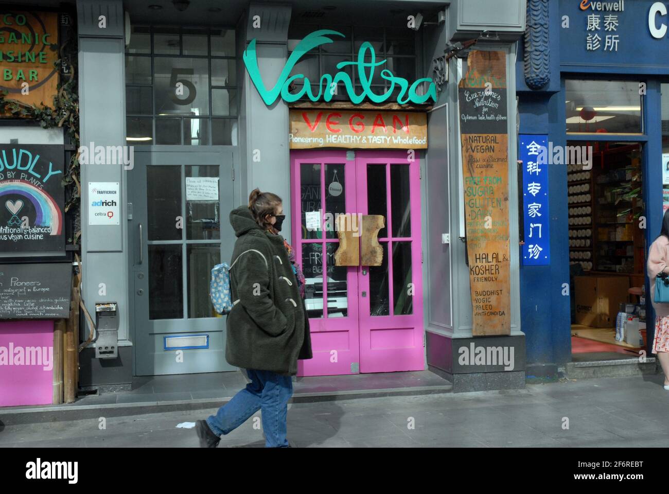 London, UK, 2 April 2021 Vantra vegan restaurant in Soho boarded up. People enjoy sunshine in West End on Good Friday as coronavirus lockdown restrictions begin to be lifted.  Credit: JOHNNY ARMSTEAD/Alamy Live News Stock Photo