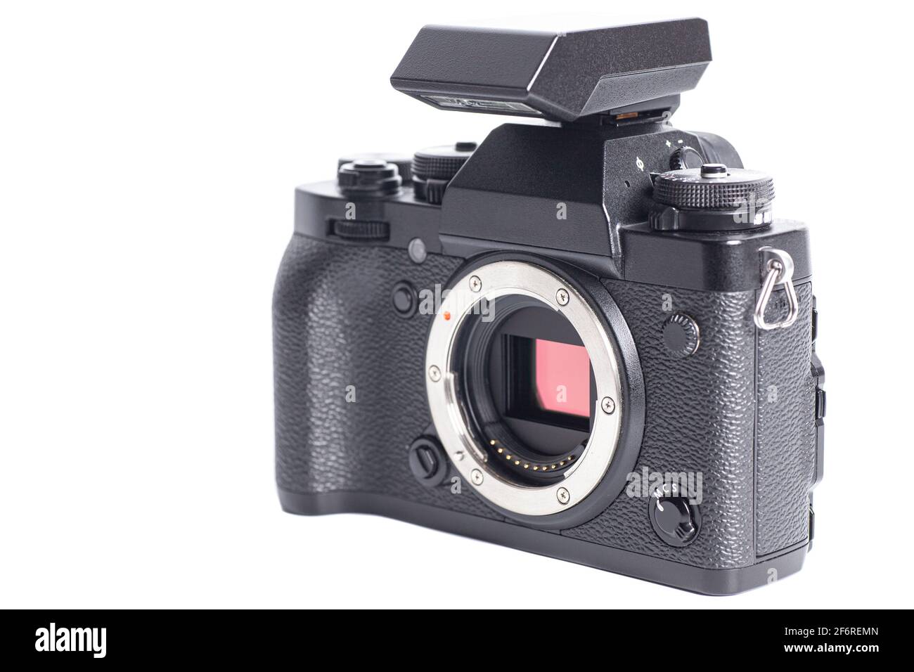 Mirrorless digital camera with flash isolated on white background Stock