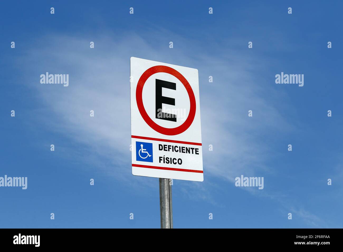 traffic sign indicating authorized parking for people with physical disabilities, wheelchair Stock Photo