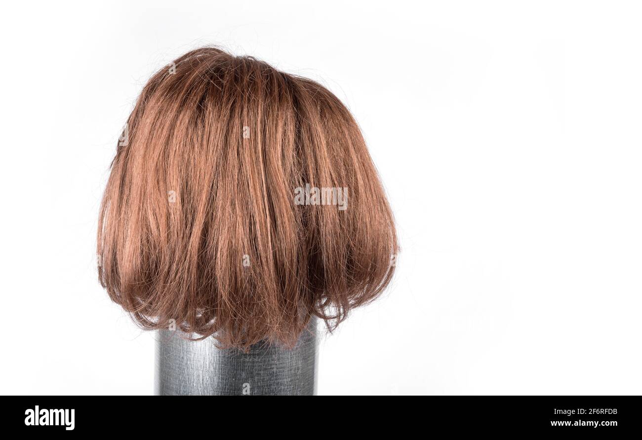 Short red hair wig on a white background Stock Photo Alamy