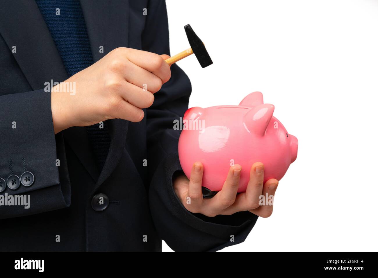 Close up of young entrepreneur hitting piggy bank with a hammer Stock ...