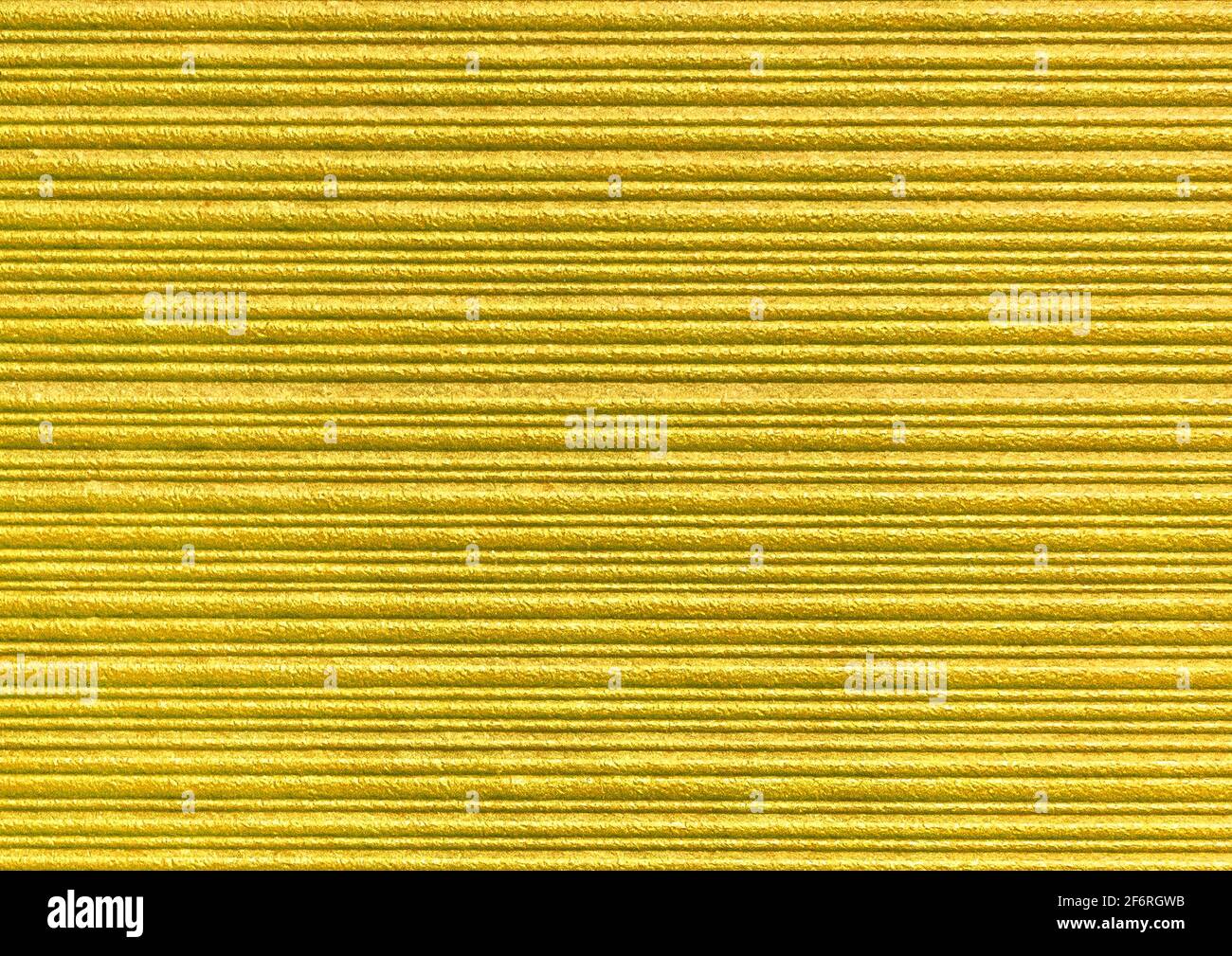 Yellow abstract striped pattern wallpaper background, gold paper texture with horizontal lines. Stock Photo