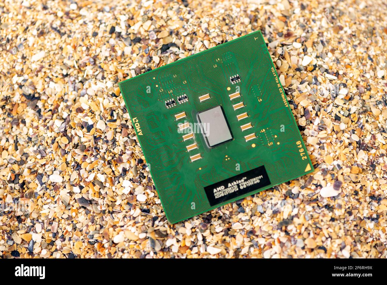 Timisoara, Romania - October 18, 2020: Close-up of an AMD Athlon 2700+ AXDA2700DKV3D processor, 2700 MHz, socket A with sand in the background. Stock Photo