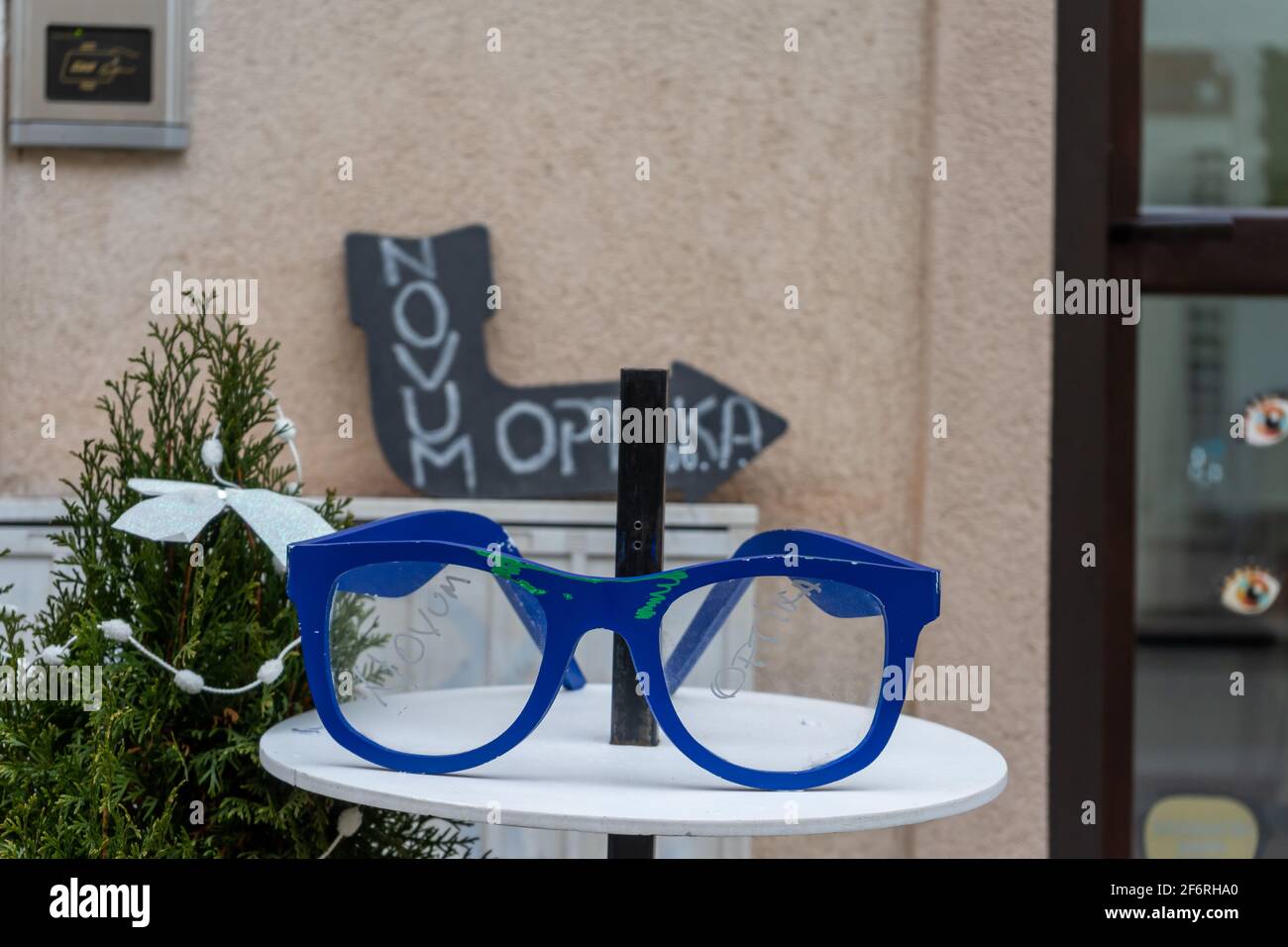 Timisoara, Romania - January 04, 2020: Big blue glasses on a table for Novum Optika Stock Photo