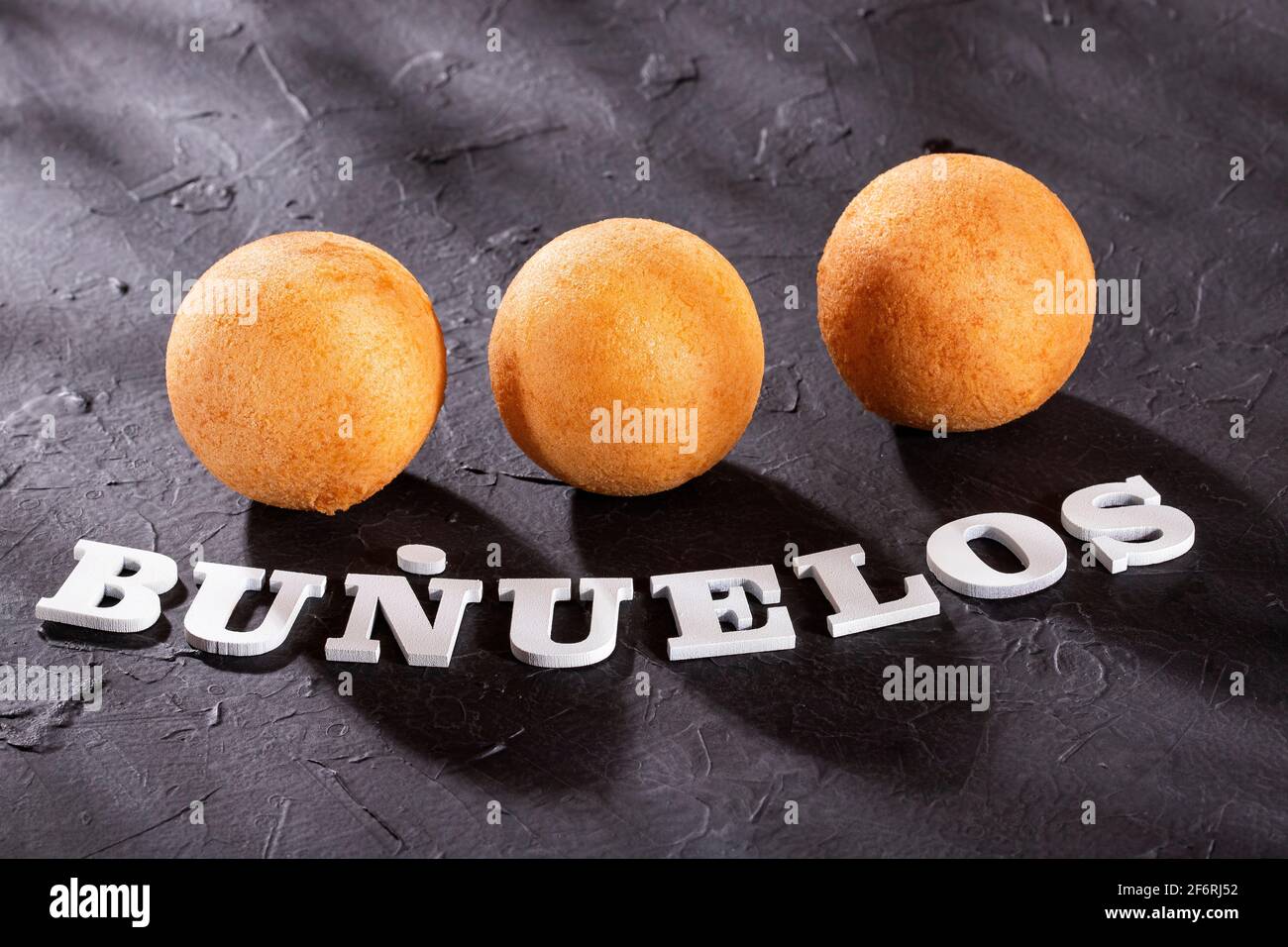 Traditional Colombian buñuelos (Deep Fried Cheese Bread) Text space Stock Photo