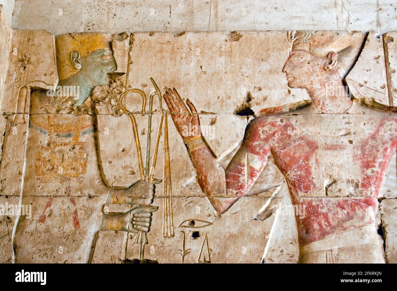 An Ancient Egyptian decorated hieroglyphic carving of the god Ptah with the Pharoah Seti. Temple to Osiris at Abydos, Egypt. Stock Photo