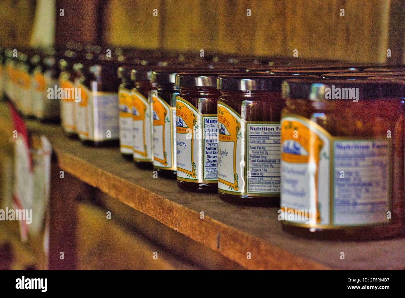 Row of homemade Jam preserves line a market shelf Stock Photo