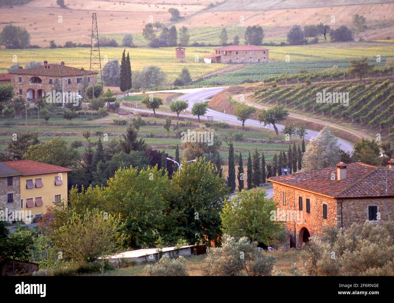 Farmhouses and fields in scenic landscape in the Valdarno region of Tuscany, Italy Stock Photo