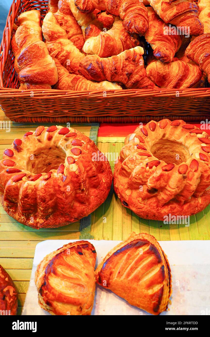 France, Food,  French pastries. Croissants, kougoulofff Alsace cake, Chaussons aux pommes. Stock Photo