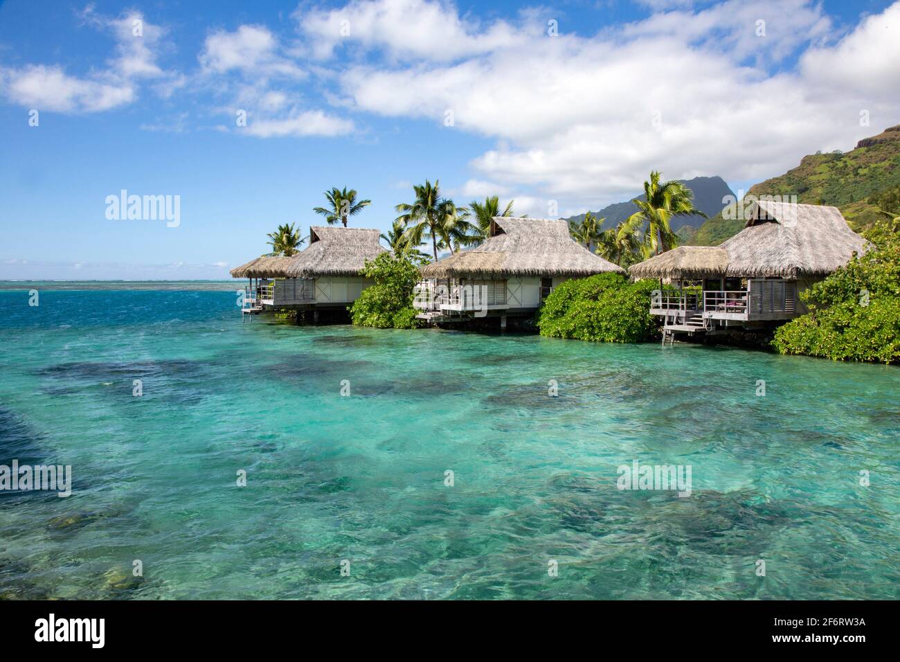 Above water bungalow on stilts with turquoise sea in South Sea. Stock Photo