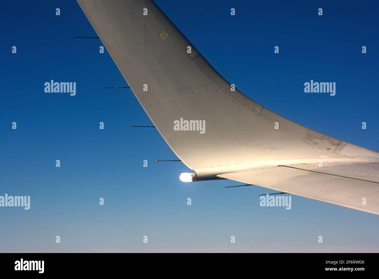 Airplane wing light during flight Stock Photo Alamy