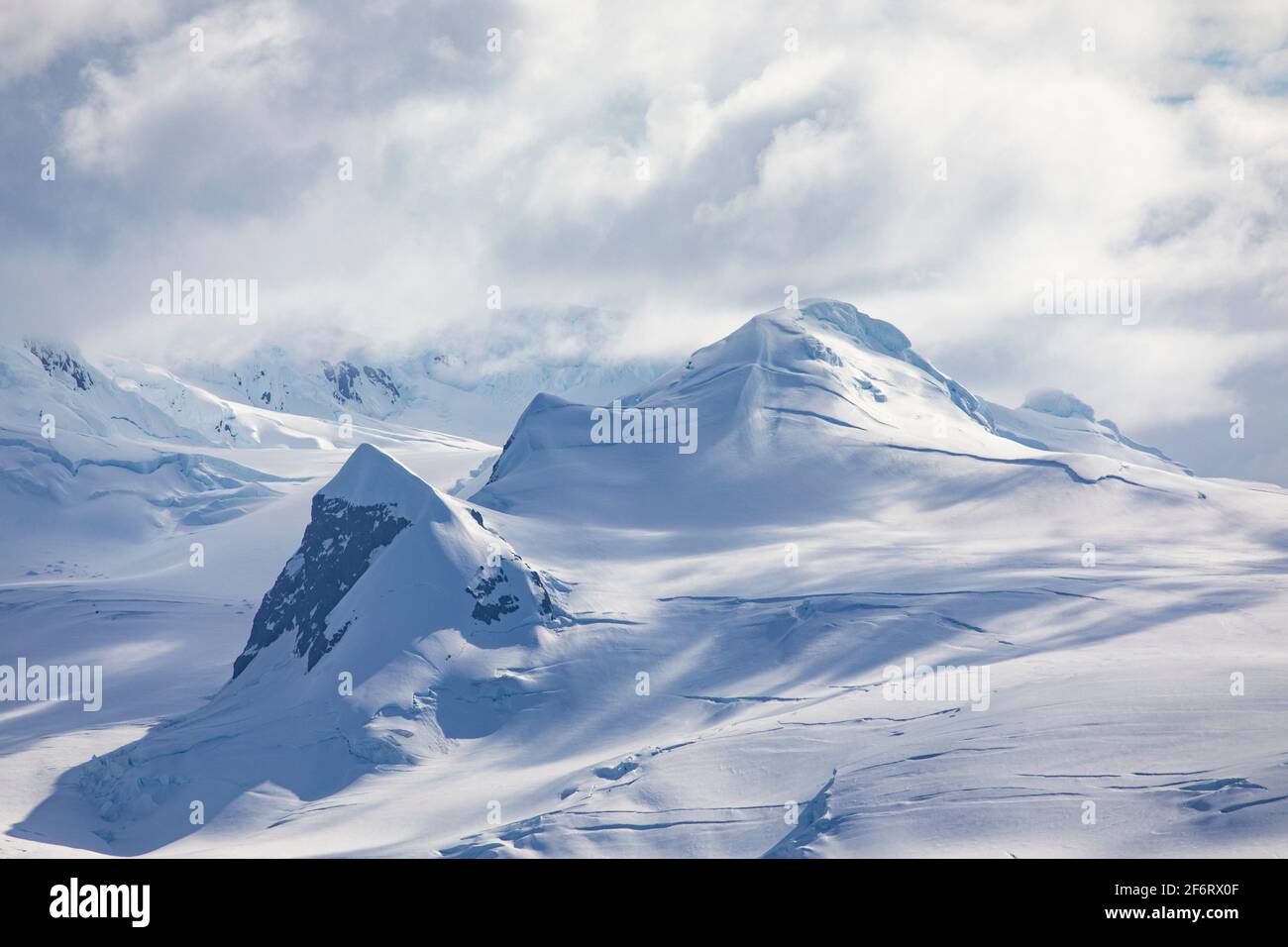 Top of mountain range with snow and ice near South Pole in Antarctica. Stock Photo