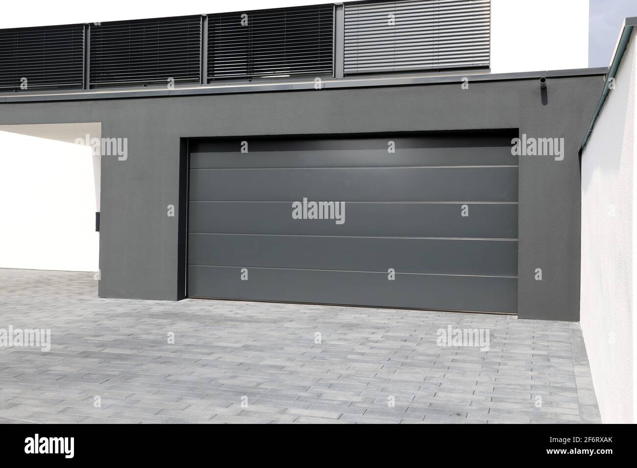 Modern new garage door (sectional door). Stock Photo