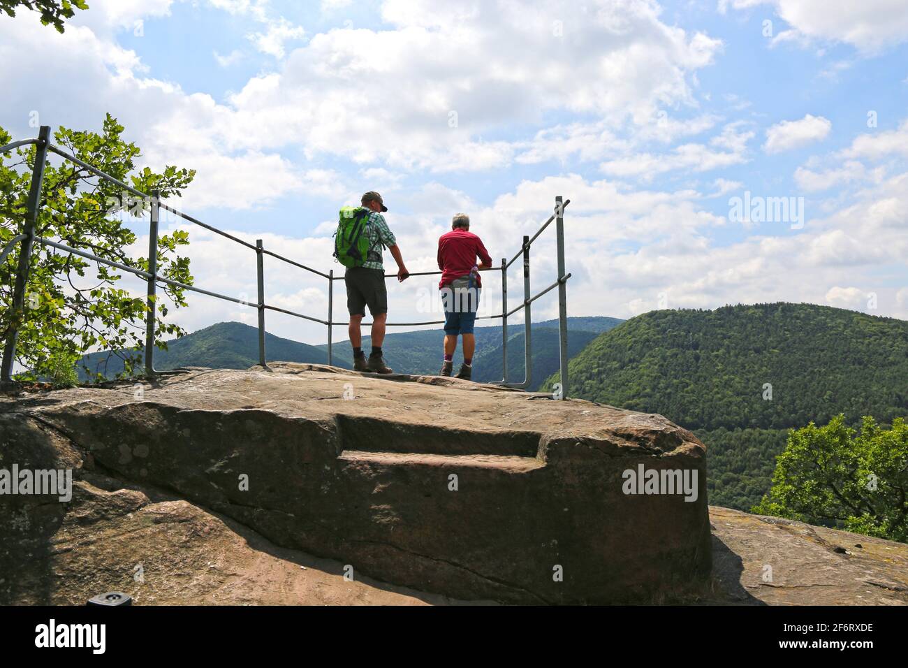 Hikers enjoy the view in the Palatinate Forest near the Wolfsburg near Neustadt (Germany). Stock Photo