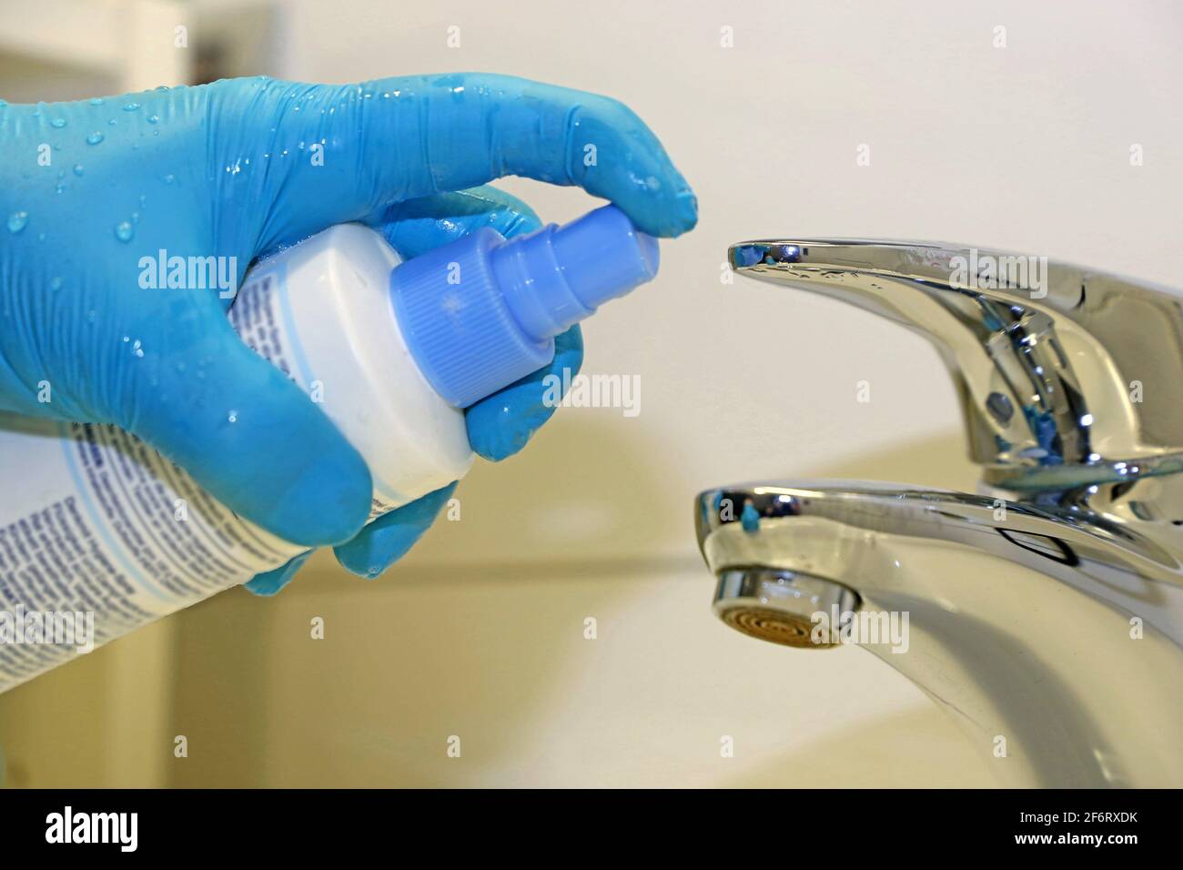 Cleaning and disinfection of a wash basin. Stock Photo