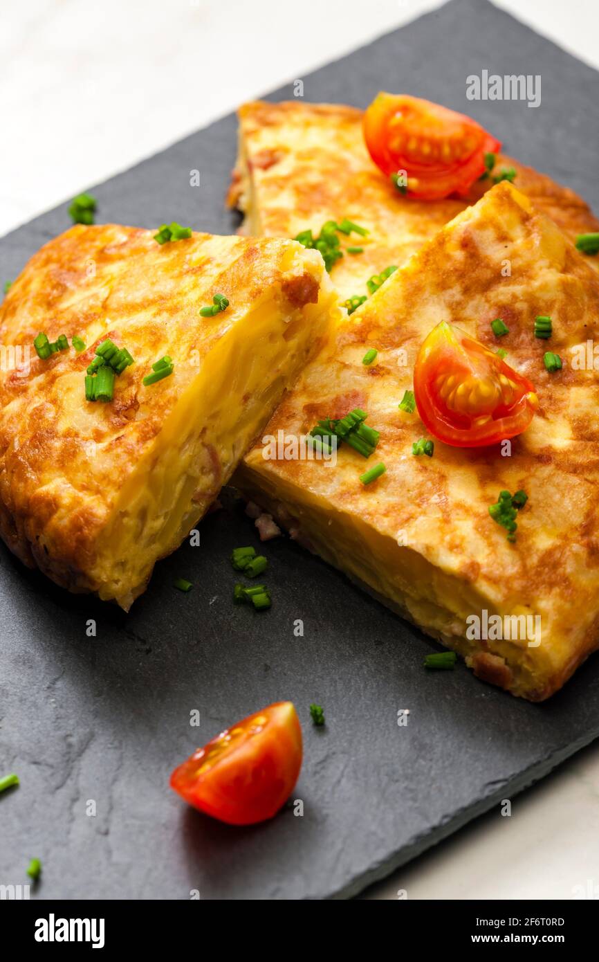 Spanish tortilla with tomatoes and chive Stock Photo Alamy