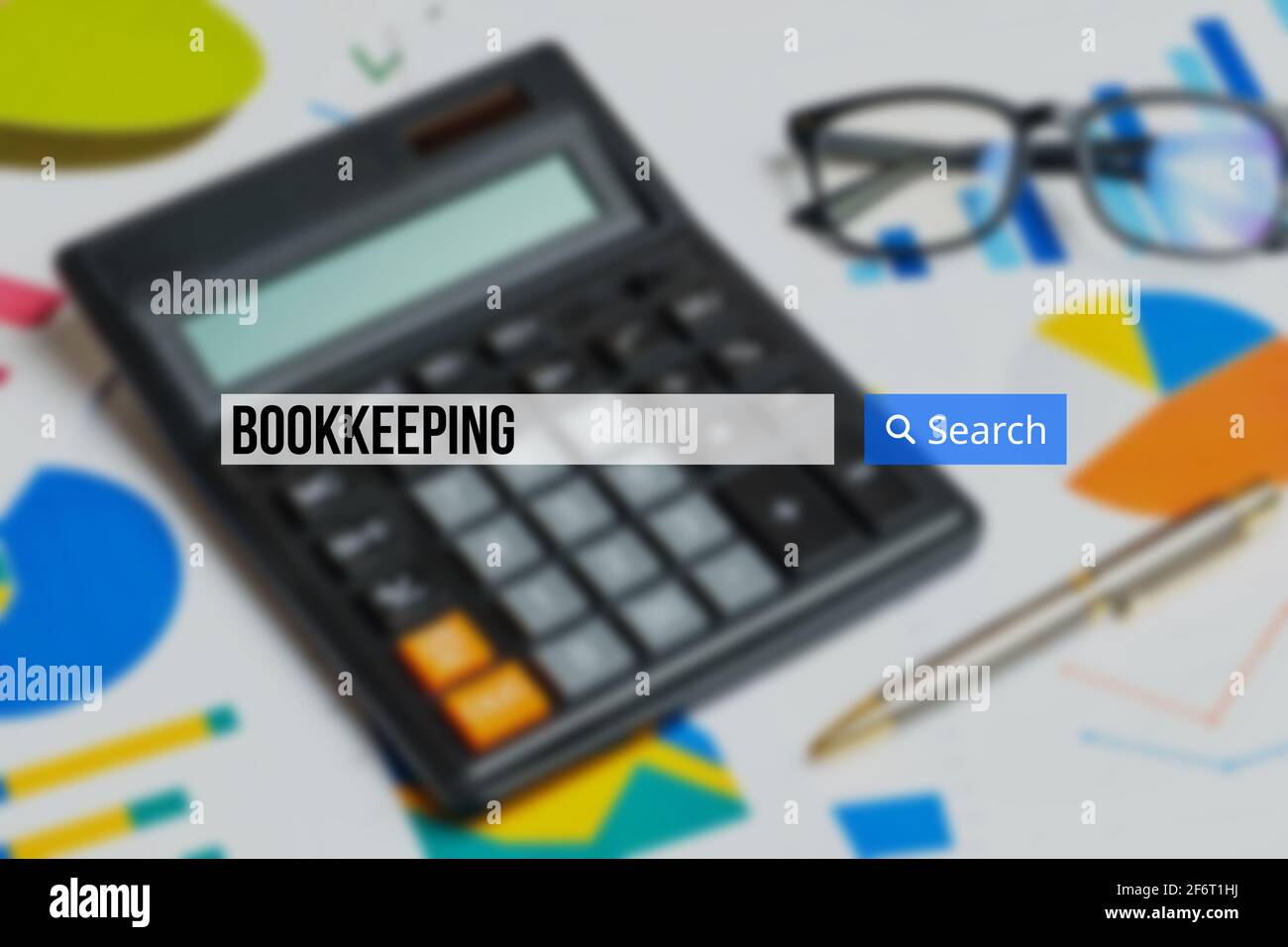 bookkeeping in the search bar on the background calculator with graphs. Stock Photo