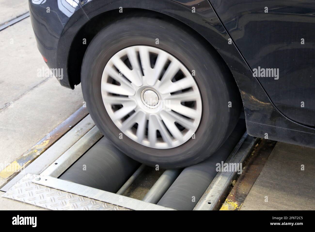 Car on the brake test bench (brake test Stock Photo Alamy