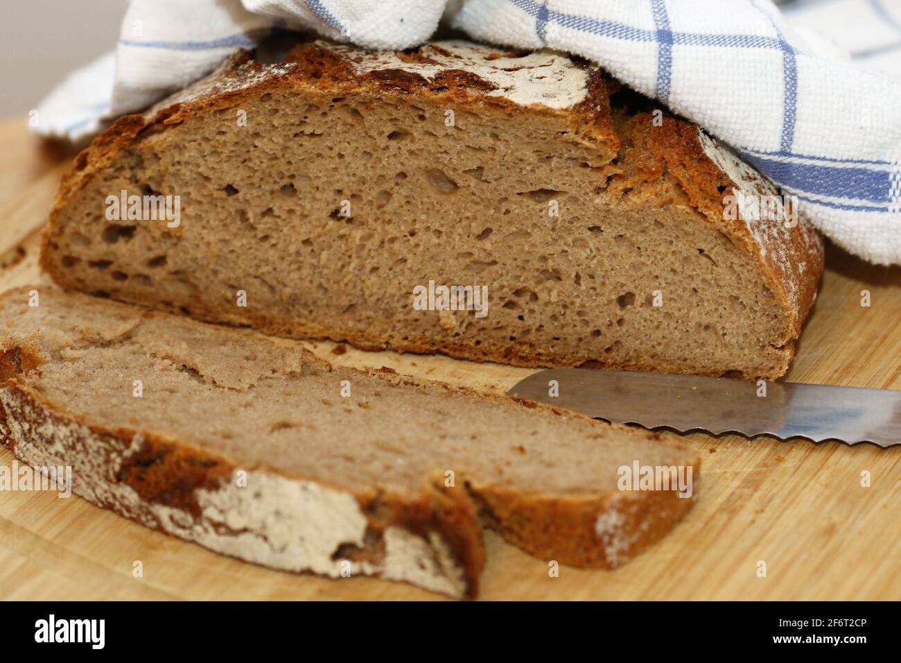 Close up of a delicious, crusty sliced bread. Stock Photo