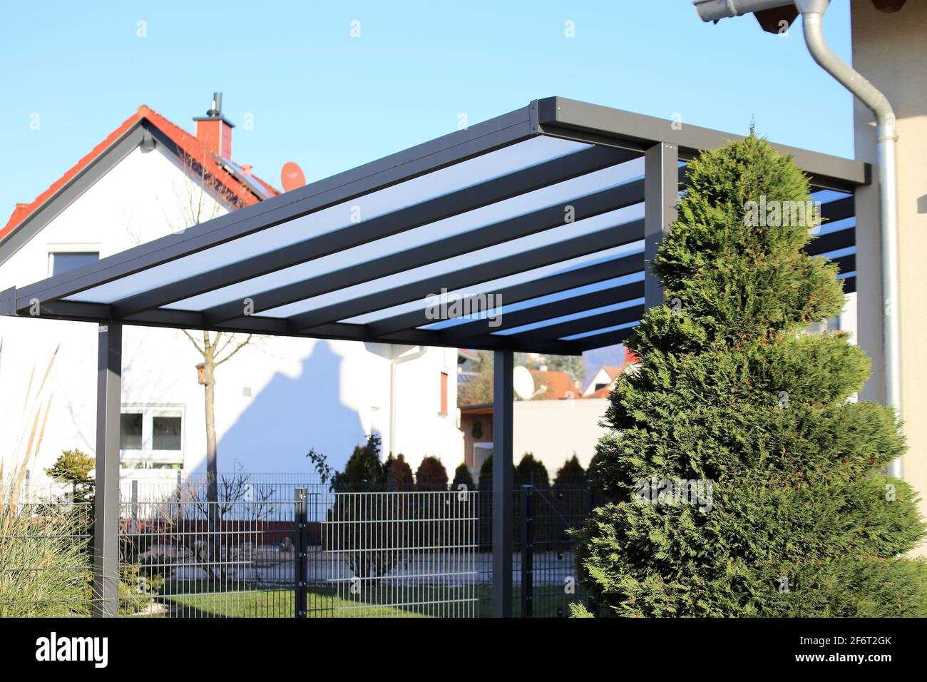 Modern and high quality carport at a single family house. Stock Photo