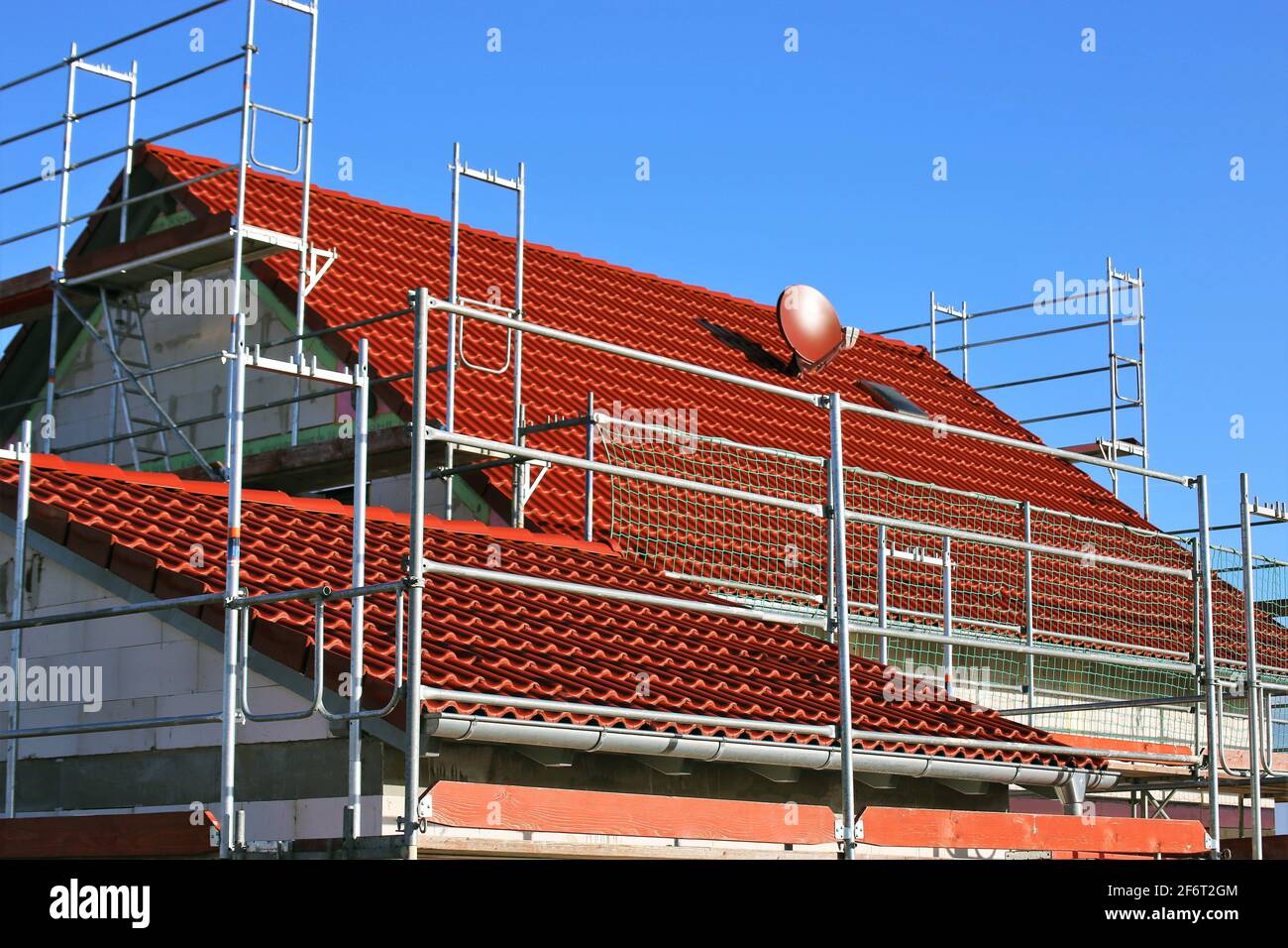New tile roof on a residential house. Stock Photo