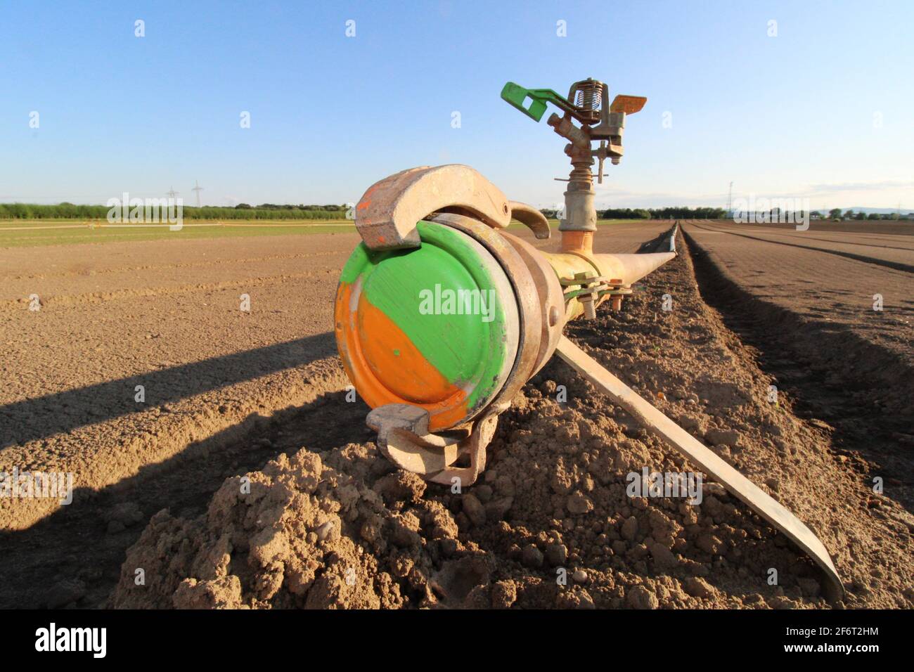 Close up of a water pipeline for agricultural irrigation. Stock Photo