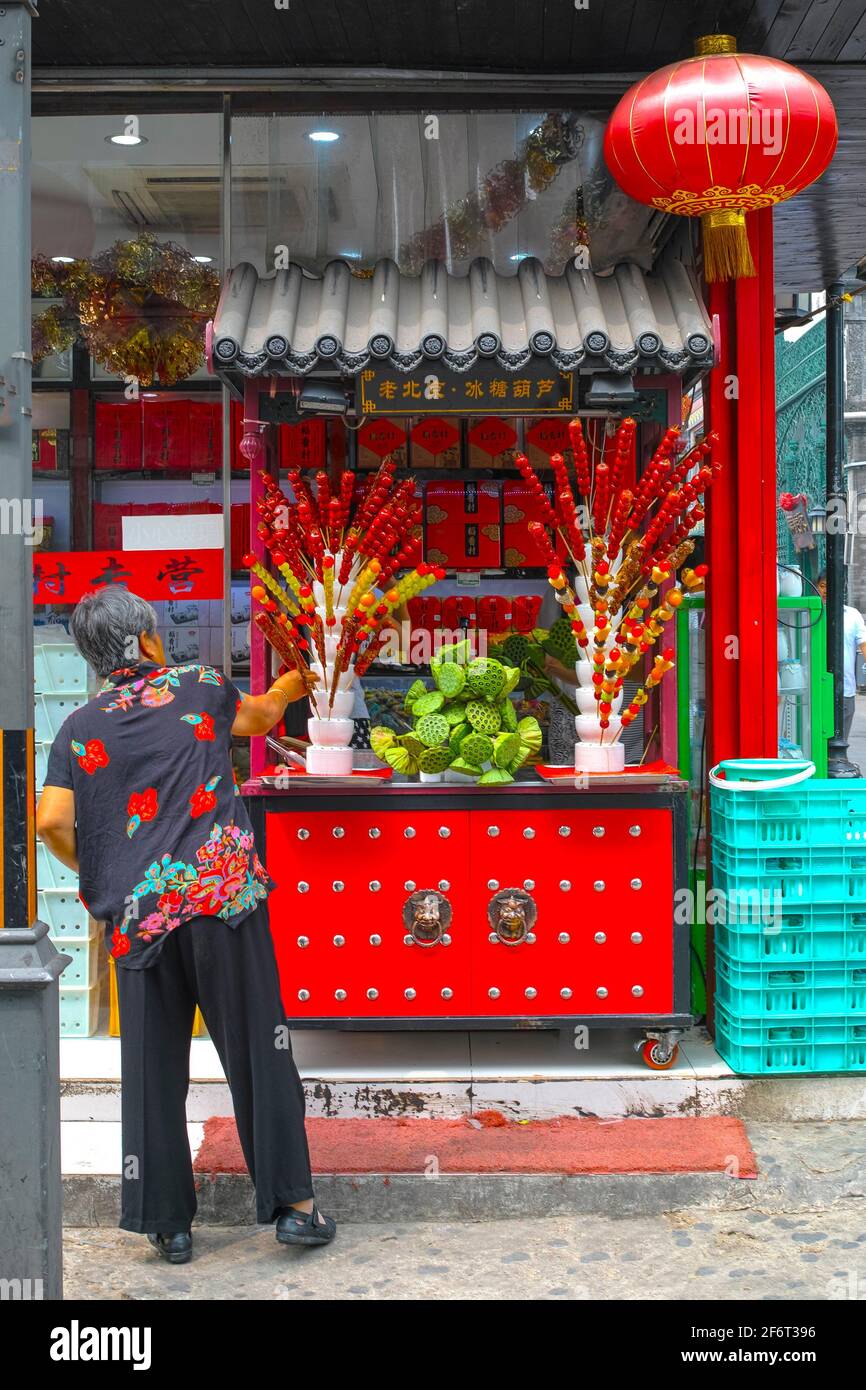 Food Stand selling Lotus seeds. Dashilan Street and Liangshidian Jie. Beijing. China. Stock Photo