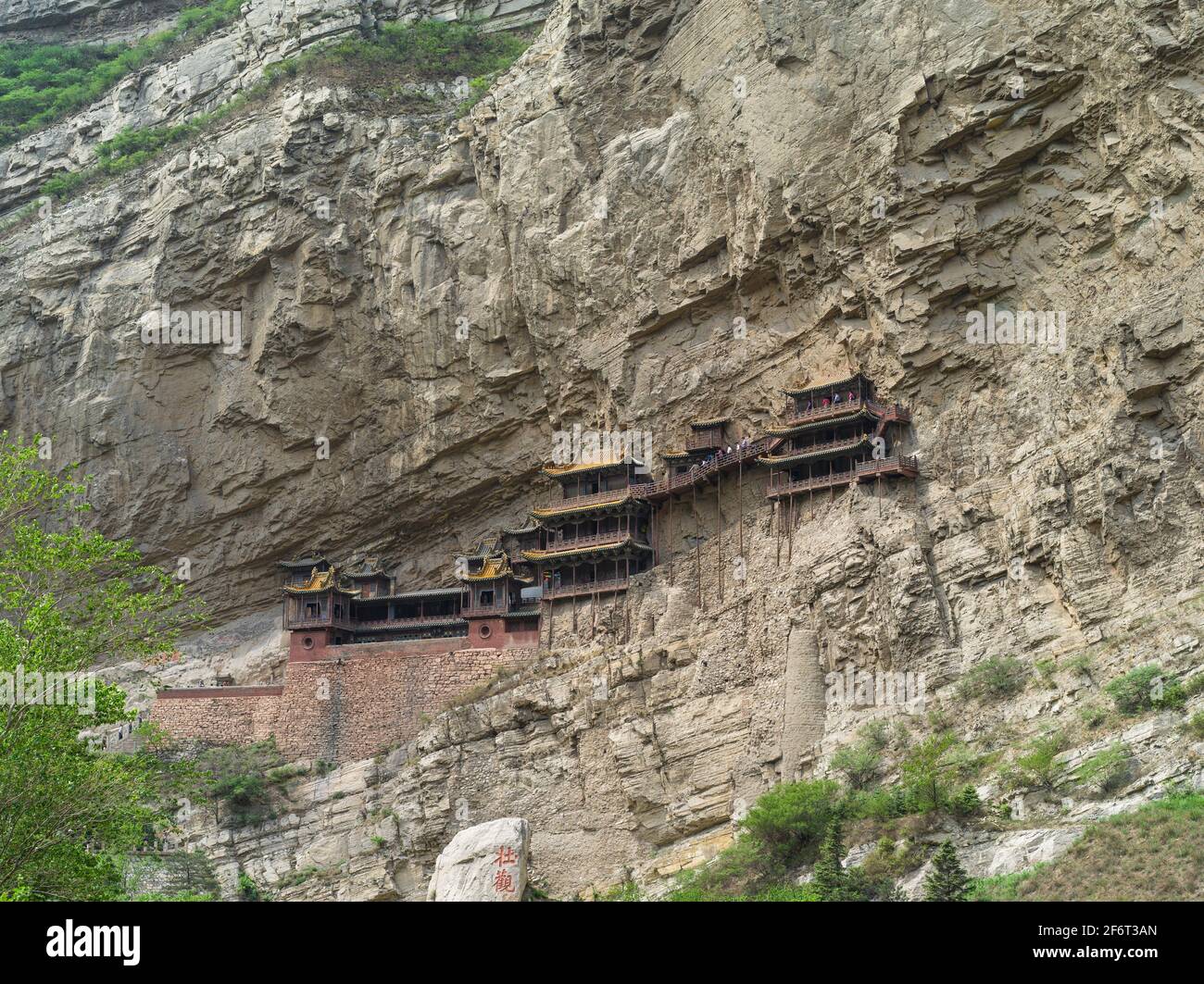 Built in 491, Hanging Monastery is an Architectural Wonder of the World, as it hangs on the West Cliff of Jinxia Gorge more than 50 meters above the Stock Photo