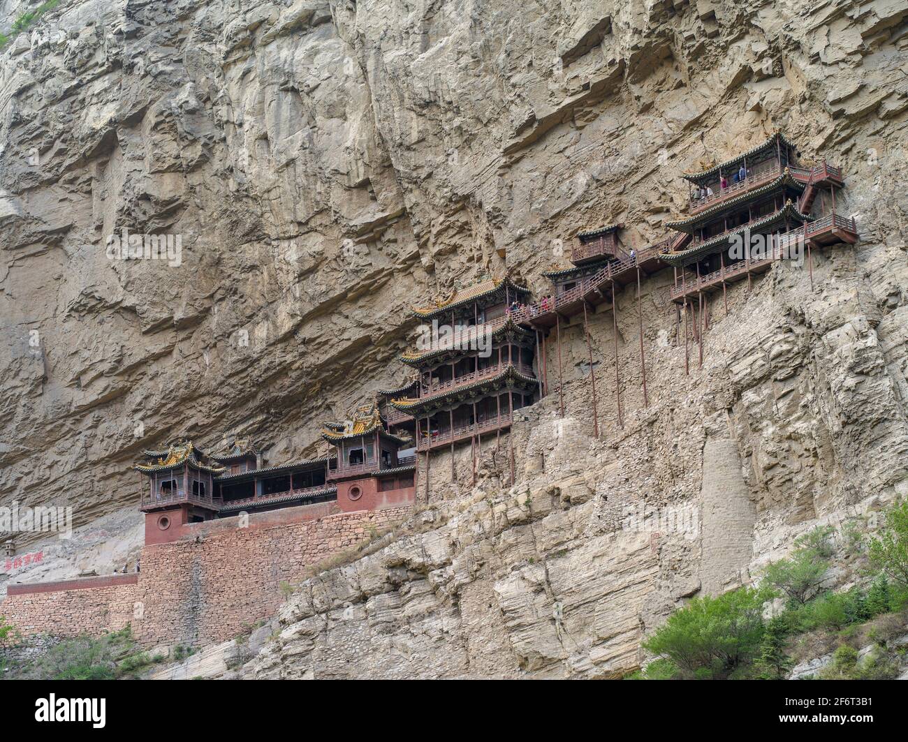 Built in 491, Hanging Monastery is an Architectural Wonder of the World, as it hangs on the West Cliff of Jinxia Gorge more than 50 meters above the Stock Photo