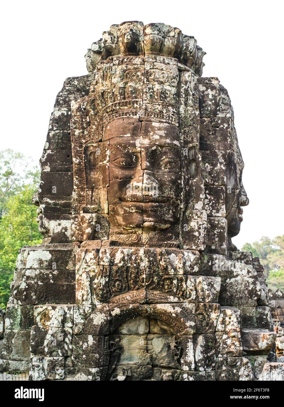 The Bayon is a well-known and richly decorated Khmer temple at Angkor in Cambodia. Built in the late 12th century or early 13th century as the Stock Photo