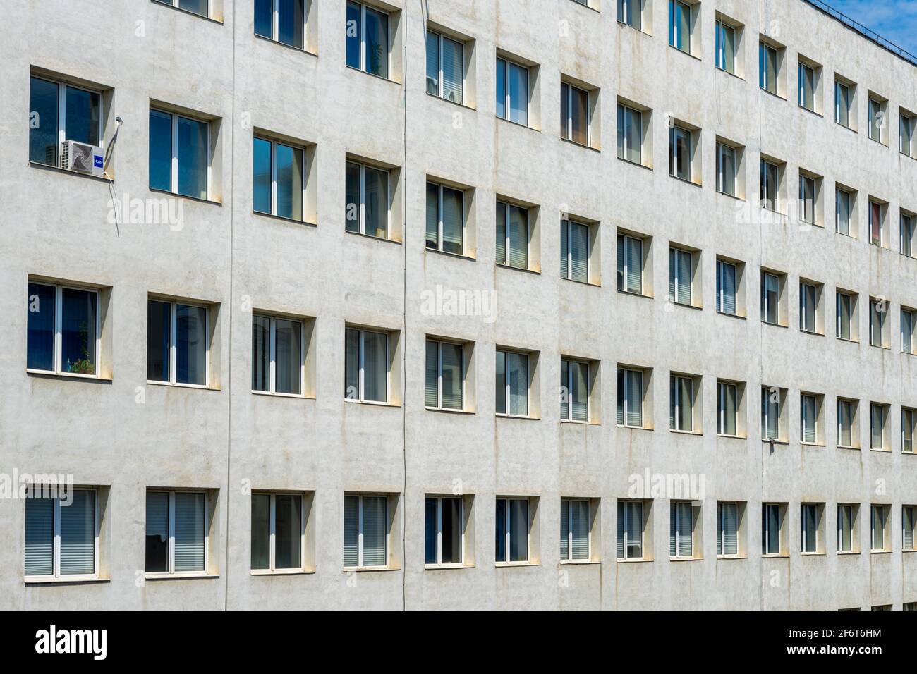 Long Row Window Modern office building filling the frame with long rows of square ...
