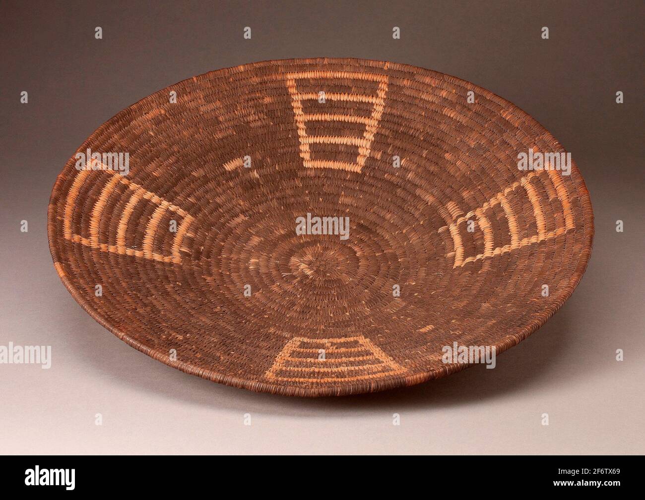 Papago. Shallow Basketry Bowl with Four Ladder-like Designs Radiating from Center-Late 19th/early 20th century-Papago (Tohono O-odham) Arizona, Stock Photo
