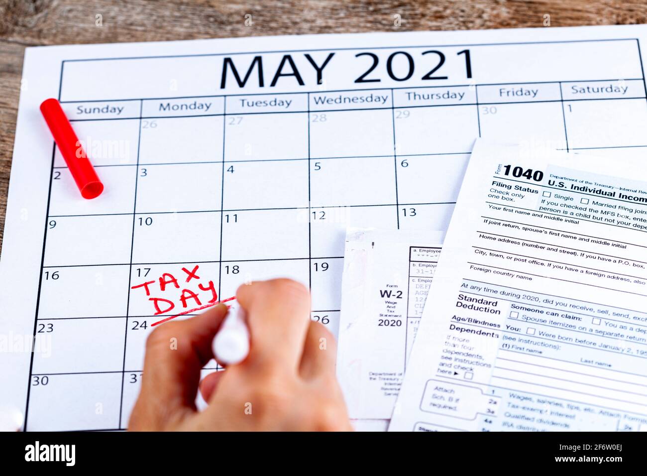 Internal Revenue Service (IRS) has extended the deadline for filing US federal income tax until May 17 2021. Concept image showing a calendar page mar Stock Photo