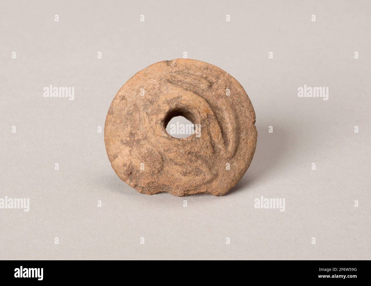 Author: Aztec (Mexica). Ear Ornament or Spindle Whorl with Modeled Frog Motifs - A.D. 1450/1521 - Aztec (Mexica) Valley of Mexico, Mexico. Ceramic. Stock Photo
