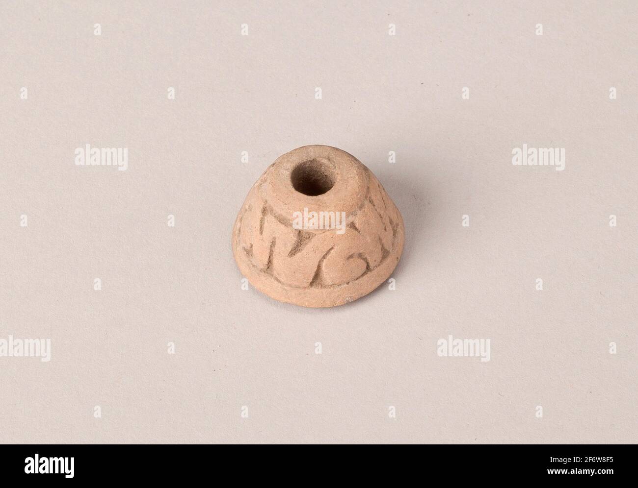 Author: Aztec (Mexica). Ear Ornament or Spindle Whorl with Modeled Design - A.D. 1450/1521 - Aztec (Mexica) Valley of Mexico, Mexico. Ceramic. 1450 - Stock Photo