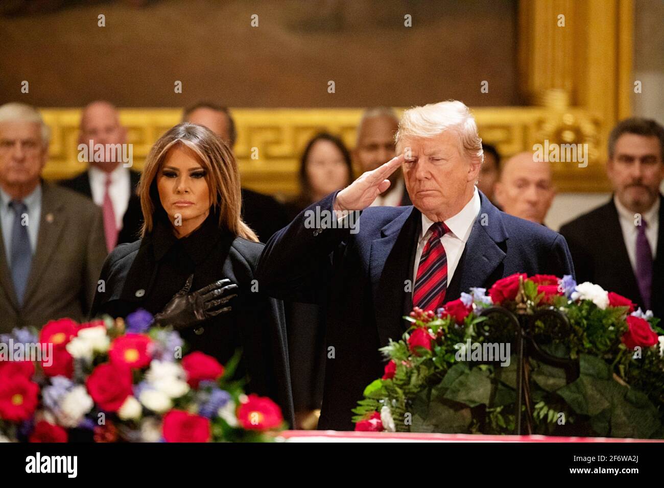 WASHINGTON (Dec. 3, 2017) President Donald J. Trump and first lady Melania Trump pay respects to former President George H. W. Bush as Bush lies in Stock Photo