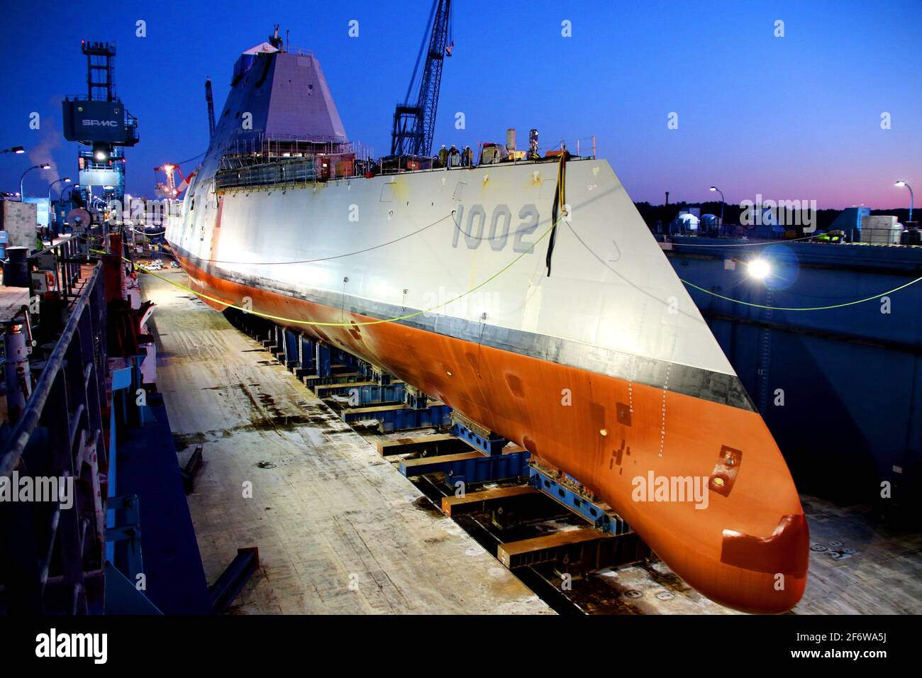 BATH, Maine (Dec. 9, 2018) Following a multi-day process that includes moving the ship from the land level facility to the dry dock, the future USS Stock Photo