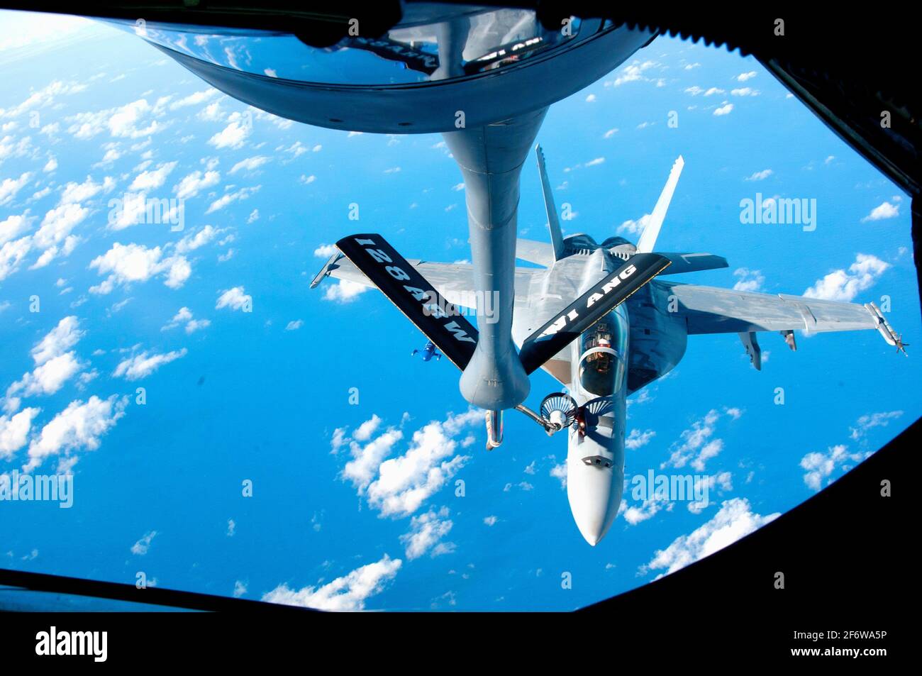 PACIFIC OCEAN (Dec. 12, 2018) An F/A-18 Hornet conducts air refueling operations, Dec. 12, 2018, over the Pacific Ocean as part of a routine Sentry Stock Photo